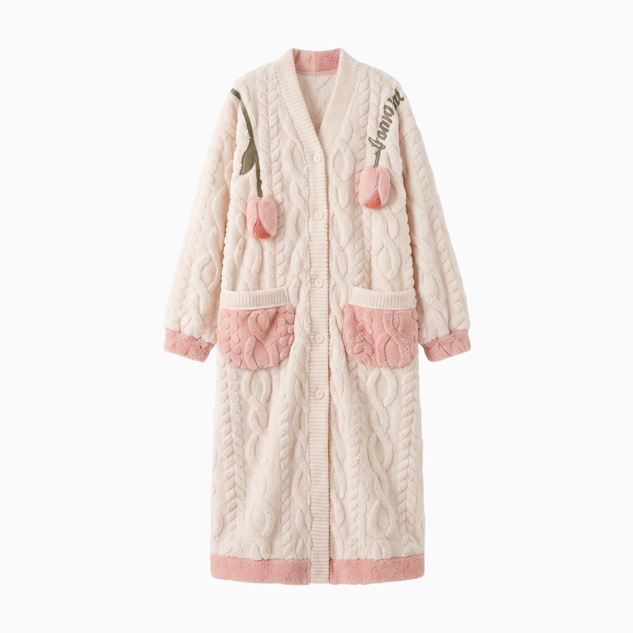 Peignoir polaire UnPeignoir long beige et rose à motif floral brodé, texture torsadée douce et poches contrastantes